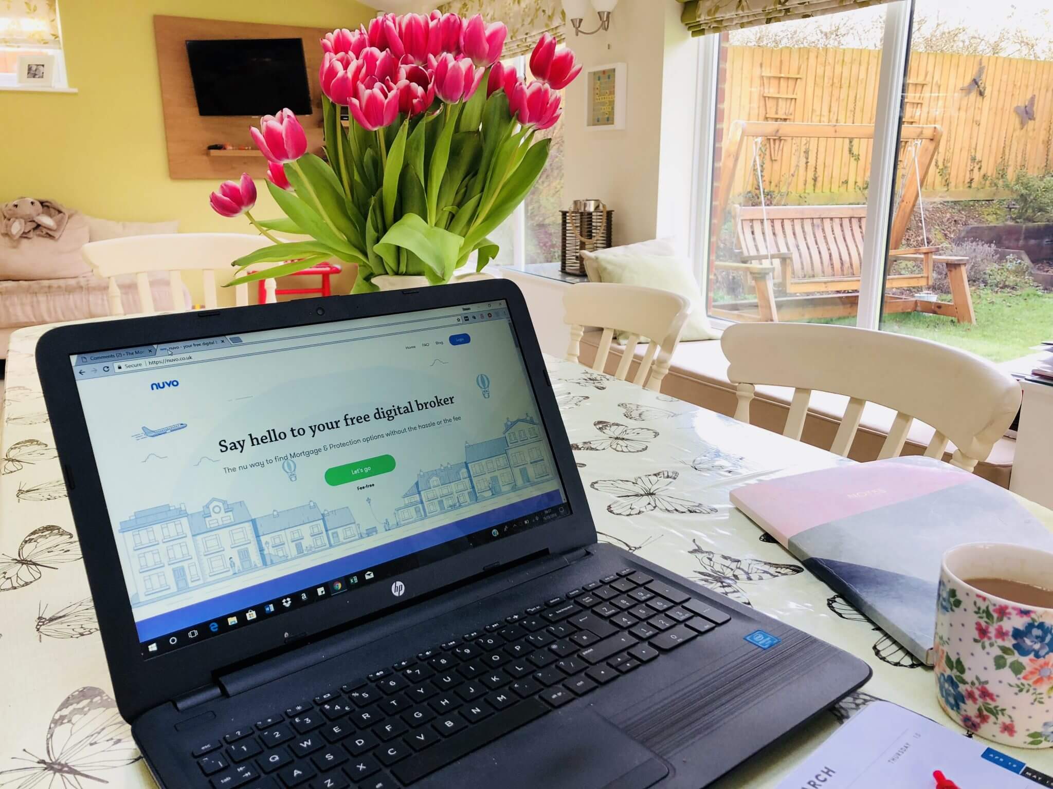 Fastest way to get a mortgage approved with Nuvo - computer on table with flowers