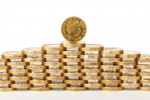 inflation and savings - piles of pound coins